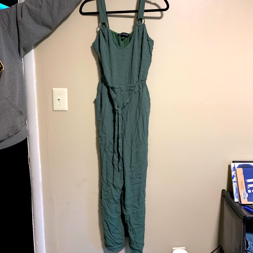Green sleeveless jumpsuit with belt